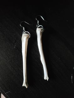 A set of real squirrel leg bone earrings. This poor squirrel died in my backyard this spring, nature took its course and cleaned the bones. I dug up the bones after a few months and scrubbed them. I also put them through multiple peroxide baths, to help whiten the colour. These earrings are 100% cruelty free, as the squirrel died naturally.  *If buying outside of Canada, please be aware of your countries import rules on animal bones. I am not liable for  bones that get taken by customs. Bone Jewellery, Animal Bone Jewelry, Leg Bones, Ear Art, Kandi Kid, Earrings Gothic, Bone Crafts, Vulture Culture, Bone Earrings