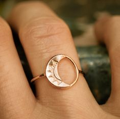 **PLEASE NOTE: This item is MADE TO ORDER. Current production times are listed below (Ready to ship in---) and in the announcement section of my shop's homepage. **Artist crafted. Original design made in Richmond, VA.** Dainty crescent moon circle ring in your choice of solid 10k gold or sterling silver. Polished finish with brushed satin accents. **If unsure of your ring size, you can be easily measured at any local jewelry store. In the event that you order the wrong size, resizing (when possi Adjustable Round Celestial Jewelry, Celestial Open Ring With Moon Phase Detail, Adjustable Moon Shaped Promise Ring, Adjustable Moon Charm Ring, Celestial Rings With Moon Phase, Celestial Adjustable Open Ring Jewelry, Celestial Moon Phase Open Ring Jewelry, Adjustable Celestial Open Ring Jewelry, Adjustable Sun And Moon Design Jewelry For Promise Ring