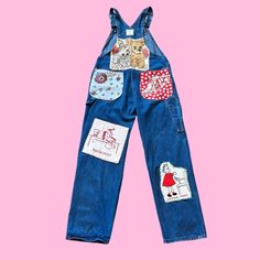 Let's Kitch-ify some overalls ! 100% Upcycled and eco friendly vintage overalls  given new life with the addition of vintage embroidery, hankies, and textiles ✨ To give it that crazy quilt feel, I've hand embroidered stitches to the pieces, a absolute labor of love ❤️ Measurements: Bust: free Waist: 34 in. Hip: 42 in. Inseam: 30 in. Length: 42 in. Total rise: 28 in. All items are made of true vintage materials and maay show signs of the age. Please look at pictures closely. Hand Painted Jumpsuit, Embroidered Retro Cotton Jeans, Vintage Denim Overalls With Patchwork, Retro Embroidered Cotton Jeans, Retro Bib Front Cotton Jeans, Retro Cotton Bib Front Jeans, Vintage Cotton Patchwork Overalls, Retro Bib Front Denim Jumpsuit, Retro Cotton Jeans With Bib Front