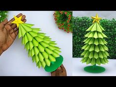 someone is making a paper christmas tree out of green leaves and yellow star on top