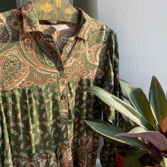 Vintage 70s moss green tiered paisley print dress with long sleeve, small collar, elastic cuff, front buttons up. Label: made in England, size marked USA 10, UK 12, Europe 38, best fit S, check the actual measurements bust 36-37" 91-93 cm bets fit 34-35"  86-88 cm waist ** hips **  length 42.5" 107 cm shoulder to waist 16" 40.5 cm sleeve 19.5" 49 cm shoulder 14" 35.5 cm Condition: very good, slight wear on the shoulders near the seams. Clothing is measured on a flat surface. Please compare the a Body Movement, Green Paisley, Paisley Print Dress, Long Sleeve Maxi, Moss Green, Tiered Dress, Dress Clothes For Women, Hip Length, Paisley Print