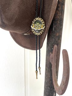 This awesome bolo tie has a large moth, it is solid metal. Quality guaranteed, picture does not do this buckle justice! The moth piece measures 1 1/2'' x 1 1/8''. It can adjust lengths, 40'' in total length. We have matching belt buckles to pair! Vintage Black Jewelry With Adjustable Cord, Black Concho Jewelry For Rodeo, Western Style Concho Bolo Ties For Festivals, Black Concho Jewelry For Western-themed Events, Adjustable Gold Western Bolo Ties, Handmade Adjustable Bolo Ties For Festivals, Handmade Festival Bolo Ties, Black Western Bolo Tie With Concho, Gold Western Bolo Tie