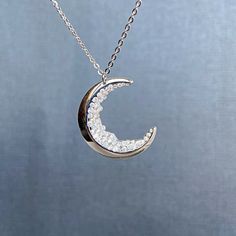 "Crescent Moon Necklace for Mom Friendship Jewelry This necklace features black cubic zirconias to accent the crescent moon and which look like a moon landscape.It is the perfect birthday, anniversary, or Christmas gift that adds shine to just about any outfit, Mothers day gift. Each item is made-to-order, which gives our pieces a unique meaning that is specific and special to you. Measurements: The moon is around 1\" (2,5 cm). The necklace is 16\" (50 cm). Moon jewelry: https://www.etsy.com/sho Silver Moon Necklace For Anniversary, Crescent Moon Charm Necklace For Anniversary, Moon Phase Necklace For Anniversary, White Gold Moon Necklace For Anniversary, Anniversary Crescent Moon Charm Necklace, Anniversary White Gold Moon Necklace, Half Moon Phase Necklace For Anniversary, Silver Crescent Jewelry With Cubic Zirconia, Cubic Zirconia Jewelry With Moon Charm For Gift