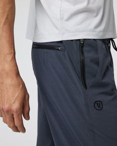 The Elevate Kore Pants are a full-length version of our best-selling athletic short. With the same partially recycled 4-way stretch fabric and moisture-wicking boxer brief liner, these strike the perfect balance between flexibility and support. Put them to work in every sport. | Vuori Elevate Kore Pants | Navy | XS Vuori makes premium performance apparel inspired by the active Coastal California lifestyle; an integration of fitness, surf, sport, and art. Breaking down the boundaries of tradition Versatile Athletic Shorts With Pockets, Short Sportswear Bottoms In Recycled Polyester, Versatile Athletic Fit Bottoms For Training, Sporty Pants With Built-in Shorts For Training, Sportswear Bottoms With Built-in Shorts In Recycled Polyester, Sporty Compressive Bottoms With Comfort Waistband, Versatile Nylon Bottoms For Training, Versatile Moisture-wicking 4-way Stretch Bottoms, Recycled Polyester Bottoms With Built-in Shorts For Training