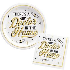 there's a doctor in the house paper plates with gold lettering on them and a white