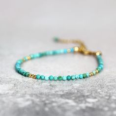 This handmade, genuine Turquoise Bracelet for women is dainty yet striking, bringing a colourful, boho touch to any outfit. Stylish and minimal worn alone, but great to mix, match & stack. A very dainty, skinny bracelet with a delicate, feminine, minimal look - made with 2.25mm tiny turquoise beads. Featuring genuine, natural, un-dyed Turquoise in a variety of green, turquoise and teal shades - all the beautiful shades of the tropical seas! Excellent cut with many facets, showing off the gor Teal Shades, Turquoise And Teal, Tiny Bead Bracelet, Delicate Feminine, Aquamarine Bracelet, Stylish Bracelet, Bohemian Bracelets, Natural Stone Bracelets, Boho Bracelet