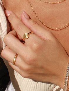 Details: Make a statement with our Coco Ring! Made with gold plated stainless steel, this ring is perfect for everyday wear. You can confidently stack your rings without worrying about any tarnishing. Our Coco Ring is also skin friendly and waterproof, so you can wear it all day and even to the beach! It's a great addition to your jewelry collection and adds a touch of elegance to any outfit. * Gold Plated Stainless Steel (PVD Plating) * Size Options: US 6 - 8 ►WATER-SAFE: Our jewelry uses a spe Gold Open Ring Jewelry For Everyday, Adjustable Yellow Gold Signet Ring For Everyday, Adjustable Gold Midi Rings For Everyday, Gold Oval Stackable Rings, Tarnish Resistant, Gold Oval Stackable Rings Tarnish Resistant, Everyday Gold Dome Ring Tarnish Resistant, Adjustable Round Band Gold-plated Jewelry, Dainty Gold Oval Stackable Rings, Modern Gold Engraved Ring For Everyday