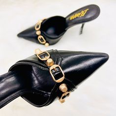 New With Box Brand: Liliana Color: Black, Gold Embellishment Tts Runs True To Size These Gorgeous Pointy Toe Mules Heel Is Must Have! They Are Super Comfortable To Put On And Off. You Can Just Slide In And Go On With Your Busy Schedule. They Are Made With Faux Vegan Leather, Padded Insole For Extra Comfort, Chic Closed Pointy Toe And Finished With Biker Chic Stud And Buckle Strap Detail. This Slip On Mules Will Go Perfect With Balenciaga City Bags! Moto Modern Luxe Classic -Easy Slip On -Closed Black Heels With Metal Pin Buckle For Spring, Black Open Toe Heels With Metal Pin Buckle, Black Closed Toe Heels With Metal Pin Buckle, Party Sandals With Metal Pin Buckle And Round Toe, Chic Summer Heels With Metal Pin Buckle, Black High Heels With Metal Pin Buckle, Chic Open Toe Heels With Metal Pin Buckle, Party Mules With Metal Feet And Open Toe, Party Open Toe Sandals With Metal Pin Buckle