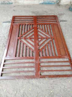 an open wooden door on the ground