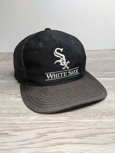 Vintage 90's Chicago White Sox Snapback Hat Cap. Has heavy fading and discoloring from age, headband has discoloring and other wear. NO holes... Ready To Wear One Size Fits Most. Vintage Black Snapback Hat With Letter Print, Vintage Baseball Trucker Hat For Streetwear, Vintage Snapback Hat For Baseball Season Streetwear, Vintage Black Baseball Cap For Sports Events, Casual Baseball Cap With Cotton Sweatband For Streetwear, Vintage Black Snapback Hat For Baseball Season, Vintage Sports Hat With Letter Print, Vintage Style Snapback Hat With Letter Print For Streetwear, Vintage Letter Print Snapback Hat For Streetwear