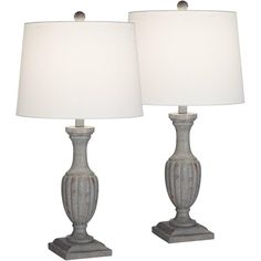 two lamps are sitting next to each other on a white background, one is turned off and the other is turned off