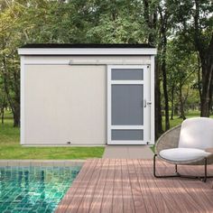 a white chair sitting on top of a wooden deck next to a swimming pool with a sliding glass door