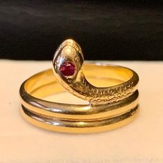 Item Is A Gorgeous Antique Victorian Snake Ring. Yellow Gold, Stamped With "900." This Unusual Stamp Indicates The Item Is 90% Pure Gold. Detailed Beveling On The Head And Tail. Ruby On Top Of The Snake's Head. This Ring Has Been In My Family For Decades. I Remember Admiring It In My Grandmother's Jewelry Box From A Very Early Age. I Don't Know Who It Belonged To, Or What It's Significance. Item Weighs 4.7 Grams. It Is Size 8. Please Contact Me With Any Questions Grandmother Jewelry, Ruby Color, Heads And Tails, Snake Ring, Pure Gold, Antique Victorian, Yellow Gold Rings, Womens Jewelry Rings, My Family