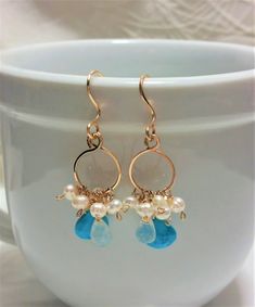 Beautiful handmade Turquoise Hoop Earrings with Lovely Turquoise Faceted Heart Briolettes, Faceted Pear Moonstones and Small Baroque Freshwater Pearls dangling from a beautiful handmade uniquely designed bail With French Earring Wires of 14k gold filled wire. Total length is approximately 1 3/4 inches (4.44 cm), and the circles are about 1/2 inch (1.3 cm) across. The Turquoise Briolette measures approximately 10 mm long x 10 mm wide, it is Heart shaped and very nicely cut. These Earrings come wi Turquoise Jewelry With Ear Wire For Wedding, Turquoise Wedding Jewelry With Ear Wire, Turquoise Hoop Earrings, Turquoise Hoops, Earrings Turquoise, Gold Filled Earrings, Earrings Wedding, Amethyst Earrings, December Birthstone