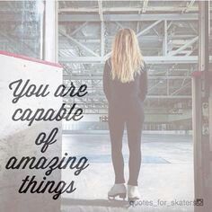 a woman standing in an empty warehouse with the words you are capable of amazing things