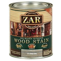 a can of wood stain with the word zar on it's side and an image of a building