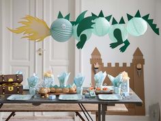 a table topped with lots of food and decorations