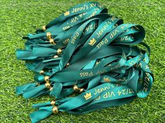 a bunch of green ribbons laying on top of a lush green grass covered soccer field