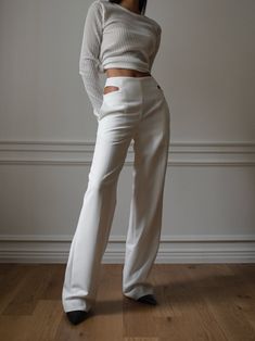 Tailored trousers with straight cut and slight flare leg. Cut out waist detail. Model is in MINUSEY S. ✔️ Free worldwide express shipping over $100✔️ Loved by 6,500+ customers✔️ Limited edition collections, maximum style⠀⠀⠀⠀⠀⠀⠀⠀⠀Stay ahead of the trend with can’t-find-anywhere-else staples. Your closet will thank you 💕 * MINUSEY S = EU 34, US 2* MINUSEY M = EU 36, US 4* 77% Polyester / 18% Rayon / 5% Spandex* Dry clean* Made in Korea - Model Height: 172cm/5'7" (US2, EU34) Modern White Wide Leg Pants For Formal Wear, Modern White Wide Leg Pants For Formal Occasions, Modern White Formal Wide Leg Pants, Modern Full-length White Pants, Modern White Full-length Pants, Modern White Wide Leg Pants For Work, Classic White Wide-leg Pants, Modern Fitted White Bottoms, White High-waisted Wide Leg Pants