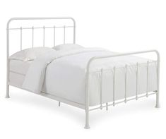 a white metal bed frame with two pillows on the bottom and one pillow in the middle