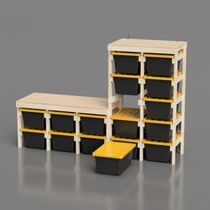 an assortment of black and yellow storage containers with shelves in the middle, on a gray background