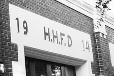 a black and white photo of a store front