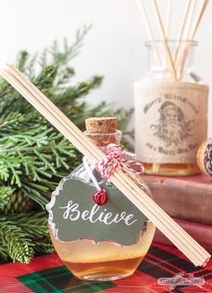 Learn how to make your own essential oil reed diffusers, featuring a delicious Christmas scent of clove, cedarwood, sweet orange and vanilla, in beautiful glass bottles that will enhance your holiday decor. #HandmadeHolidays Smores Christmas, Diy Holiday Gift Wrapping, Christmas Scent, Spring Fair