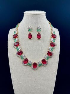 This is an incredibly beautiful and exquisite ruby necklace, with a luxurious texture and a luster comparable to a real diamond. If you are looking for a similar piece of jewelry, trust me, it won't disappoint you Materials: Rhinestone,18k Gold Plated. Necklace Size: 41 cm long. Earrings Size: 1.3cm wide, 3.5cm long. ** Please look through all the pictures I have provided, as they are part of my description.** ==Care Instructions== *To maintain the luster of your jewelry, avoid contact with wate Wedding Jewelry Set, Ruby Necklace, Bib Necklaces, Ear Stud, Earrings Wedding, Necklace Size, Stunning Earrings, Wedding Jewelry Sets, Gold Plated Necklace