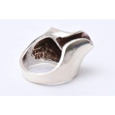 This is part of Chairish’s Costume Jewelry assortment.  This wonderful hallmarked sterling silver ring is both sculptural and modernist. It is marked 925 sterling and TH-47. It has a great design to it and has dimension. The ring size is 5.25. It has height of 1.5" H. The width is 1". The open horseshoe shape on top looks best when facing to the right. It has a wide band in the back. Well made.  Sorry the photos do not do justice to the beauty of this unusual ring. It is from the 60's. It is ver Modernist Open Ring With Polished Finish, Modernist Hand Cast Sterling Silver Rings, Contemporary Silver Ring With Unique Design, Formal Sculptural Silver Jewelry, Unique Polished Finish Signet Ring, Unique Polished Signet Ring, Unique Polished Open Signet Ring, Unique Open Signet Ring With Polished Finish, Modernist Silver Dome Ring Open Style