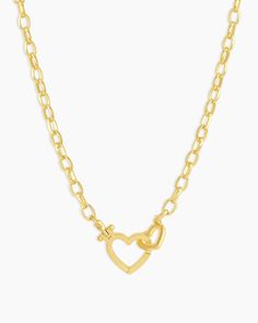 Parker Gold Heart Necklace Add a hint of romance to your everyday look with the gold plated Parker Gold Heart Necklace. This beautiful necklace features a heart hinge closure, which adds a little love to your layered necklaces. Preppy Gold Necklaces, Women Wishlist, Unique Gold Jewelry, Necklace Product, Black Labradorite, Orange Agate, Yellow Opal, Iridescent Crystal, Gold Heart Necklace