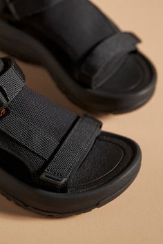 Recycled polyester upper Recycled EVA insole Recycled rubber sole Buckle styling Imported | Hurricane Ampsole Volt Sandals by Teva in Black, Women's, Size: 8, Polyester/Rubber/EVA at Anthropologie Black Sandals With Textured Sole For Outdoor, Nylon Sandals With Rubber Sole And Round Toe, Comfortable Textile Sandals With Round Toe, Black Nylon Sport Sandals With Arch Support, Summer Nylon Sport Sandals With Rubber Sole, Functional Sport Sandals With Round Toe, Outdoor Sandals With Textured Sole And Round Toe, Black Slip-on Sandals With Vibram Sole, Functional Slip-on Summer Sandals