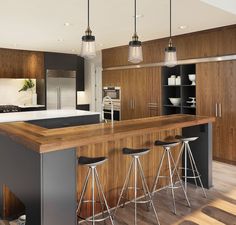 a kitchen with an island and bar stools