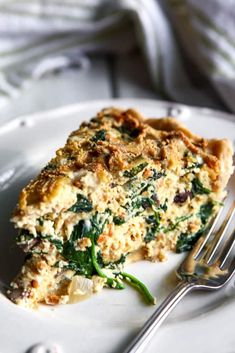 a piece of quiche on a plate with a fork