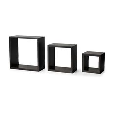 three black cubes sitting next to each other