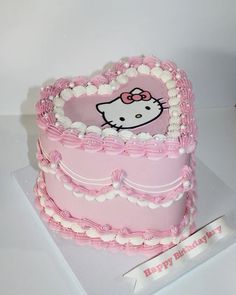 a hello kitty birthday cake with pink frosting