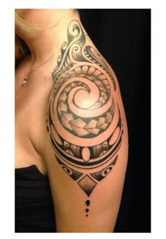 a woman's arm with a tattoo on it that has an abstract design in the middle