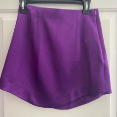 Satin Feel Zipper Closure Size Small Never Worn! Scoop Lining High Waisted Chic High Waist Purple Mini Skirt, Purple Flared Mini Skirt For Party, Chic High-waisted Purple Skirt, Chic Purple Mini Skirt For Night Out, Chic Purple Short Skort, Elegant Purple Mini Skirt For Night Out, Party-style Purple Flared Mini Skirt, Chic Purple Mini Skort, Chic Purple Mini Length Bottoms