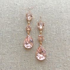 Make a statement with these extra long dangling statement earrings. Made with faceted pear and chaton cut Swarovski® crystals set in brass in plated in precious metal. These earrings are surely stunners, shown in blush pink and rose gold finish. Nickel free Precious metal plated brass Length [2.75" | 7cm] Proudly handmade in the USA Arrives gift boxed Elegant Pink Long Drop Chandelier Earrings, Rose Gold Dangle Linear Earrings For Party, Rose Gold Long Drop Earrings For Party, Rose Gold Crystal Chandelier Drop Earrings, Rose Gold Crystal Chandelier Earrings, Rose Gold Drop Crystal Earrings For Party, Long Drop Rose Gold Jewelry For Party, Rose Gold Crystal Dangle Chandelier Earrings, Rose Gold Crystal Chandelier Dangle Earrings