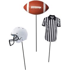 two footballs and a referee's jersey on sticks, one is black and white