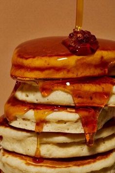 a stack of pancakes with syrup on top