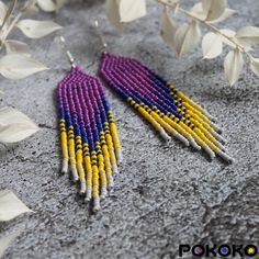 "These purple yellow beaded earrings pair amazingly with any outfit, dressy or casual. They will emphasize your individuality and compliment your personality on various occasions. Perfect for looking pulled together and on trend. They are made of high-quality Czech colored beads with sterling silver hooks and silicone plugs. Colors: purple, blue, yellow, beige. Length: 4.1 inches (10.5 cm) Width: 0.8 inches (2 cm) Materials:     Czech \"Preciosa\" beads     Durable synthetic thread     Sterling silver ear hooks     Silicone plugs If you are on the hunt for a gift that will show your significant other some love, these picks are a great solution to surprise and delight. I hope you can find everything here that you were looking for. If you have any questions related to earrings design, please Yellow Beaded Earrings With Ear Wire For Festivals, Handmade Yellow Beaded Earrings For Festival, Handmade Yellow Beaded Bohemian Earrings, Bohemian Yellow Beaded Dangle Earrings, Yellow Beaded Earrings With Ear Wire For Summer, Yellow Beaded Drop Earrings For Festival, Yellow Dangling Beads Earrings For Summer, Yellow Beaded Drop Earrings For Summer, Summer Yellow Beaded Earrings With Ear Wire