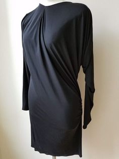 Description Size 40   This is a lovely dress by Lanvin ALBER ELBAZ in "Black"100% Viscose.   This long sleeve dress has an asymmetrical design. COLLECTIBLE !! It is marked a French size 4, a US size 10, and measures approximately: 14" shoulder to shoulder, up to 46" bust, 38" waist, 35" hips, and 38" long from top of shoulder to the hem.    The dress is in excellent condition. Formal Long Sleeve Dress With Draped Sleeves, Elegant Long Sleeve Ruched Bodycon Dress, Elegant Dresses With Draped Sleeves For Fall, Elegant Fall Dresses With Draped Sleeves, Long Sleeve Ruched Midi Dress For Dinner, Formal Fall Dress With Draped Sleeves, Long Sleeve Dress With Draped Sleeves For Dinner, Long Sleeve Dress With Draped Sleeves For Fall Party, Formal Dresses With Draped Sleeves For Fall