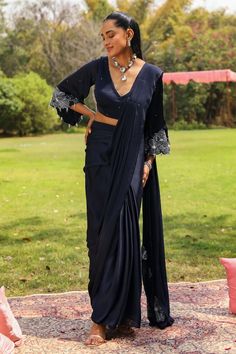 Navy blue pre-draped organza frilled saree. Paired with a blouse with crystal droplet embellished bell sleeves. - Aza Fashions Elegant Pre-draped Saree With Cape Sleeves, Elegant Fitted Pre-draped Saree With Cape Sleeves, Elegant Pre-draped Saree With Sheer Dupatta In Silk Chiffon, Elegant Pre-draped Silk Chiffon Saree With Sheer Dupatta, Elegant Silk Chiffon Pre-draped Saree, Silk Saree With Ruffles For Evening, Elegant Pre-draped Saree With Cape Draped Sleeves, Elegant Silk Chiffon Pre-draped Saree In Traditional Style, Elegant Draped Blouse Piece With Ruffles