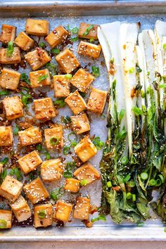 tofu and greens on a baking sheet