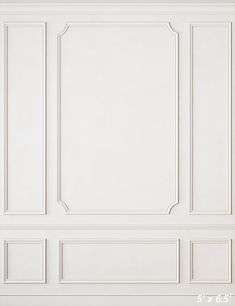 an empty room with white walls and paneling