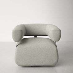 an upholstered chair and footstool in grey fabric