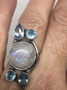 Large Vintage ring set with huge Rainbow Moonstone with Aquamarine Low content silver not sterling About an in long Size 6 can be resized at my jeweler for a $10-$20 fee All rings are shipped free in the US in a nice gift box. Check out our over a THOUSAND great reviews Engraving is $4 per letter and is not always perfect depending on the piece. It can take a few days if the jeweler is busy. This is payable to Paypal Judithsltd@gmail.com Spiritual Round Blue Topaz Jewelry, Blue Topaz Natural Stone Ring, Blue Topaz Ring With Natural Stones, Unique Blue Moonstone Ring, Multi-stone Round Moonstone Jewelry, Multi-stone Moonstone Round Jewelry, Round Multi-stone Moonstone Jewelry, Moonstone Multi-stone Round Jewelry, Unique Moonstone Gemstones