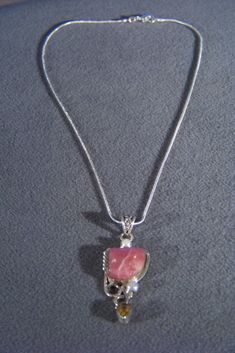 I am offering you this spectacular sterling silver (stamped) vintage pendant and necklace chain. This is a fabulous detailed design. It features a huge square striated pink agate stone. It is bezel set, and accented with a large tear drop/ pear shaped golden citrine stone. There are also 2 round shaped genuine cultured pearl accent stones. It measures approx. 2 1/4 inch by 3/4 inch, and weighs 17 grams. The necklace is a sturdy classic snake chain that measures a very versatile 18 inches in leng Pink 925 Stamped Necklace For Gift, Pink Stamped 925 Necklace Gift, Pink Sterling Silver Necklace Gift, Pink Engraved Pendant Jewelry, Engraved Pink Pendant Jewelry, Pink Rectangular Stone Jewelry For Gift, Pink Sterling Silver Jewelry With Large Pendant, Elegant Pink Sterling Silver Crystal Necklace, Pink Sterling Silver Necklace With Large Pendant