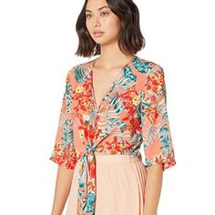 Gorgeous Peachy Loose Fit Blouse With Tropical Print Accents 3/4 Bell Sleeves Deep V-Cut Neckline & Tie Front Strings 100% Polyester Measurements - Armpit To Armpit: Approximately 20 Inches - Shoulder To Hem: Approximately 17 Inches Smoke/ Pet Free Home Peach V-neck Summer Blouse, Summer Peach V-neck Blouse, Floral Print Half Sleeve Blouse For Beach, Half Sleeve Floral Print Blouse For Beach, Half Sleeve Blouse With Floral Print For Beach, Vacation Half Sleeve Blouse With Floral Print, Spring Half Sleeve Blouse For Brunch, Peach Floral Print Summer Blouse, Peach Short Sleeve Summer Blouse