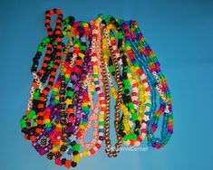 many different colored beads on a blue background